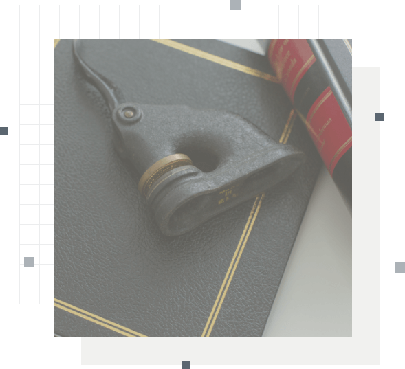 Embosser stamp laying on its side over a document